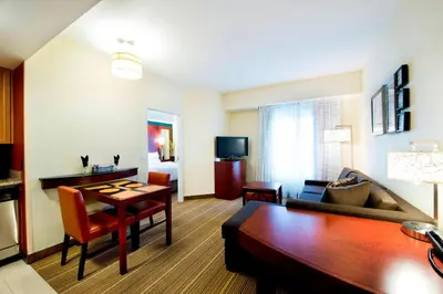 a living room with a couch and a table at Residence Inn by Marriott Toronto Vaughan in Vaughan