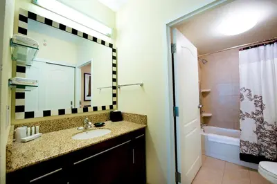 a bathroom with a sink and a mirror at Residence Inn by Marriott Toronto Vaughan in Vaughan