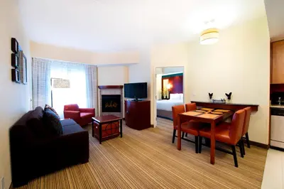 a living room with a couch and a table in a room at Residence Inn by Marriott Toronto Vaughan in Vaughan