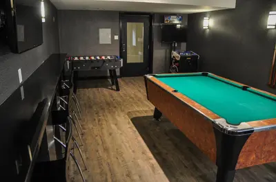 a room with a pool table and a bar at Residence & Conference Centre - Kitchener-Waterloo in Kitchener