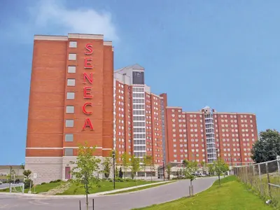 a large red brick building with a sign on it at Residence & Conference Centre - Toronto in Toronto