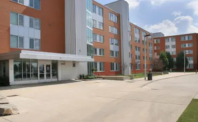 an empty parking lot in front of a building at Residence & Conference Centre - Brampton in Brampton