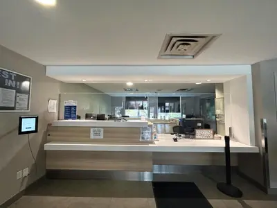 a fast food restaurant with a counter in a building at Residence & Conference Centre - Brampton in Brampton
