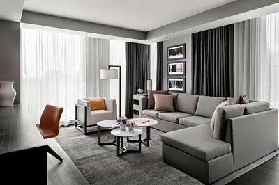 a living room with a couch and a table at Toronto Marriott Markham in Markham