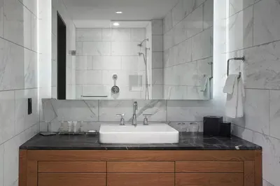 a bathroom with a sink and a mirror at Toronto Marriott Markham in Markham