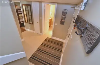 a stairway with a bench and a stair case at Large modern ground floor condo at Mountain Walk in Blue Mountains