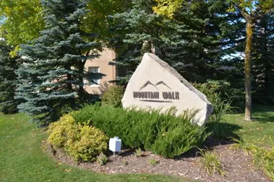 a sign that says mountain wolf in a yard at Large modern ground floor condo at Mountain Walk in Blue Mountains