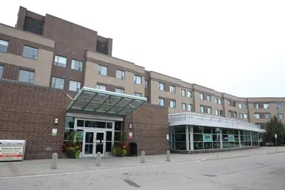 a large brick building with a building at Residence & Conference Centre - Hamilton in Hamilton