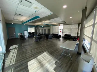 an empty room with desks and chairs in an office at Residence & Conference Centre - Hamilton in Hamilton