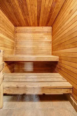 a wooden sauna with wooden steps in a wooden wall at Deluxe Inn in Toronto