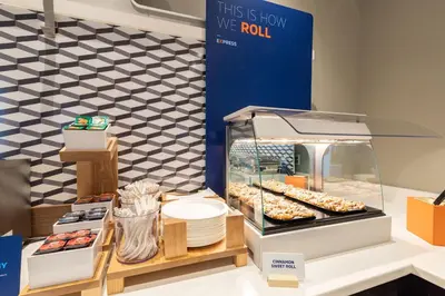 a display case with donuts and other pastries at Holiday Inn Express Hotel & Suites Clarington - Bowmanville by IHG in Bowmanville