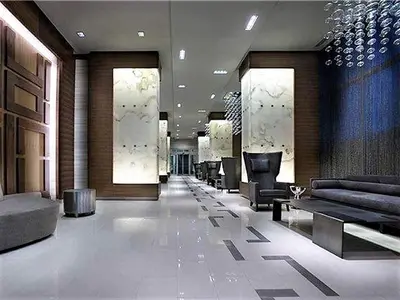 a lobby with couches and chairs in a building at Upscale Suite at CN Tower, Metro Convention & Rogers Centre in Toronto