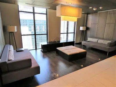 a living room with a couch and a table at Upscale Suite at CN Tower, Metro Convention & Rogers Centre in Toronto