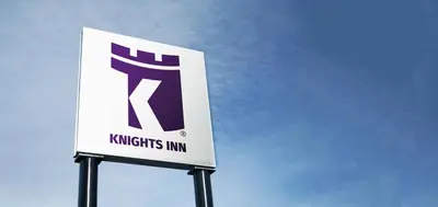a sign for a krispy kitties inn at Knights Inn Fort Erie in Fort Erie