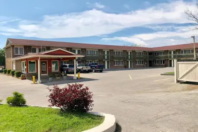 an empty parking lot in front of a building at Knights Inn Fort Erie in Fort Erie