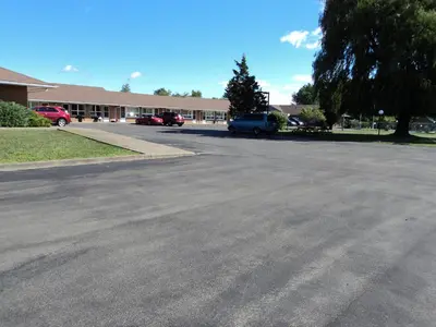 an empty parking lot in front of a building at Port Motel in Port Colborne