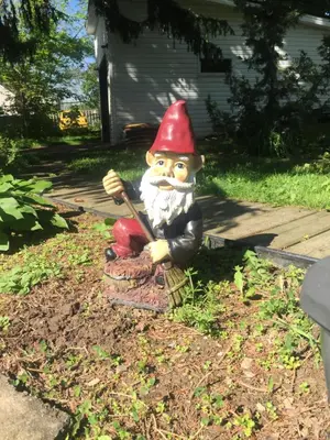 a statue of a gnome holding a baseball bat at Susan's Villa in Niagara Falls