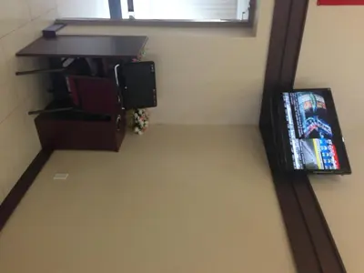 a room with a desk and a tv in a room at Days Inn by Wyndham Brampton in Brampton