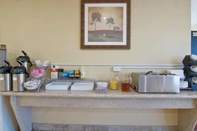 a counter in a hotel room with food on it at Travelodge by Wyndham Trenton in Trenton
