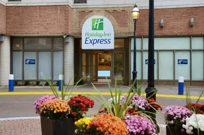 a hospital with flowers in front of a building at Holiday Inn Express Toronto Downtown by IHG in Toronto