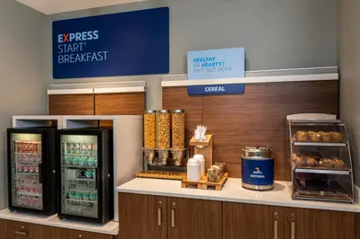 a fast food counter with two refrigerators in a store at Holiday Inn Express Toronto Downtown by IHG in Toronto