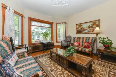 a living room with two couches and a coffee table at Niagara Inn Bed and Breakfast in Niagara Falls