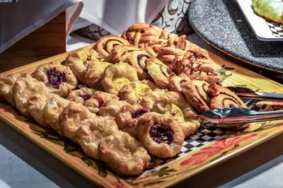 a tray of pastries on top of a table at Monte Carlo Inn & Suites Downtown Markham in Markham