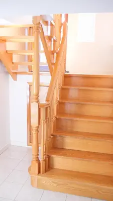 a wooden staircase in a home with wooden floors at Richview Gardens Apartment in Toronto