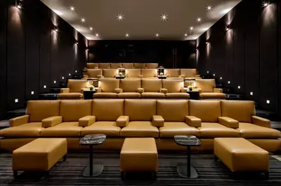 a theater room with brown leather seats and lights at The Hazelton Hotel in Toronto