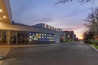 a building with a gico sign on the side of it at GLō Best Western Mississauga Corporate Centre in Mississauga