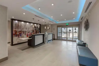 an office lobby with a large painting on the wall at Executive Residency by Best Western Toronto-Mississauga in Mississauga