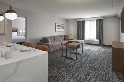 a living room with a couch and a table at Homewood Suites by Hilton Toronto Vaughan in Vaughan