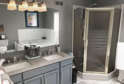 a bathroom with two sinks and a shower at Butler Creek House in Niagara on the Lake