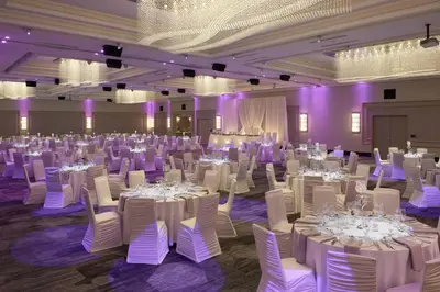 a banquet hall with white tables and white chairs at TownePlace Suites by Marriott Oshawa in Oshawa