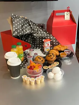 a table with a box of food and a box of food at Old Ivy Walk in Niagara on the Lake