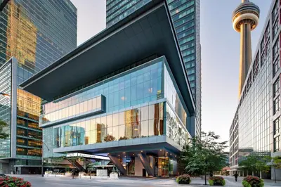 a building in a city with tall buildings at The Ritz-Carlton, Toronto in Toronto