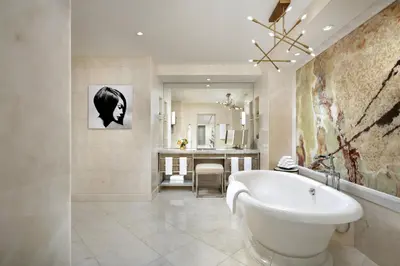 a bathroom with a white tub and a sink at The Ritz-Carlton, Toronto in Toronto