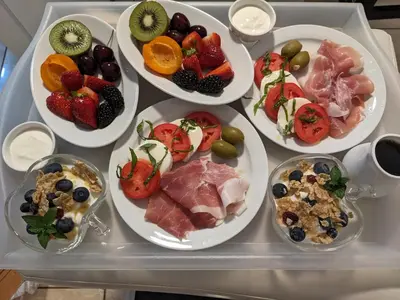 a tray filled with plates of food on a table at Via Veneto - Old Town in Niagara on the Lake