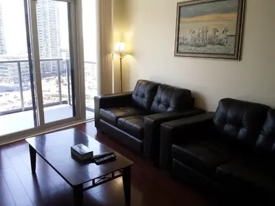a living room with a couch and a coffee table at 2 BEDROOM 2 Bathroom Best Value Prime Location in Missisauga in Mississauga