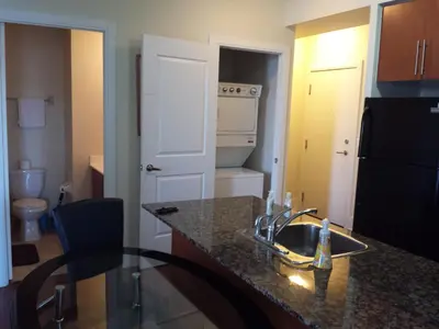 a kitchen with a sink and a counter top at 2 BEDROOM 2 Bathroom Best Value Prime Location in Missisauga in Mississauga
