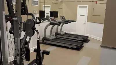 a row of cardio machines in a gym at 2 BEDROOM 2 Bathroom Best Value Prime Location in Missisauga in Mississauga