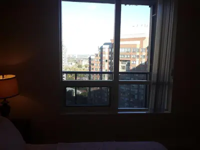 a large window with a view of a city at BEST LOCATION/SPECTACULAR VIEW 2 BEDROOMS FURNISHED CONDO S/L RENT in Mississauga