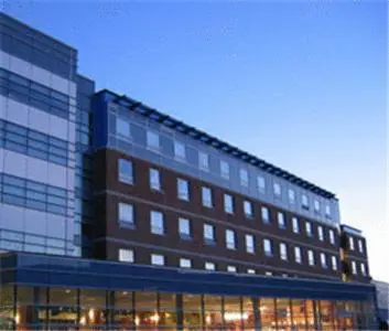 a large office building with a lot of windows at Residence & Conference Centre - Oshawa in Oshawa