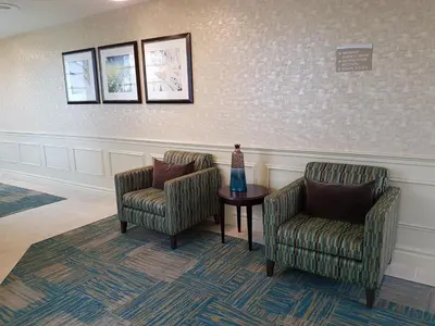 a waiting room with two chairs and a table at Best Western Plus Durham Hotel & Conference Centre in Oshawa