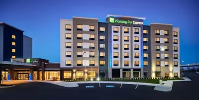 a hotel building with a sign on top of it at Holiday Inn Express Niagara-On-The-Lake by IHG in Niagara on the Lake