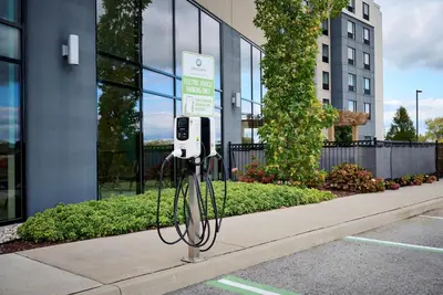 a pay phone on a sidewalk in front of a building at Holiday Inn Express Niagara-On-The-Lake by IHG in Niagara on the Lake