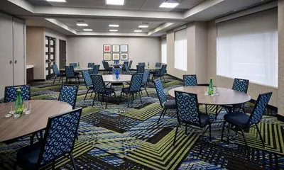 a room with tables and chairs in a classroom at Holiday Inn Express Niagara-On-The-Lake by IHG in Niagara on the Lake