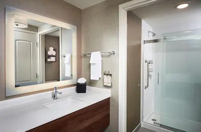 a bathroom with a sink and a shower at Staybridge Suites Niagara-On-The-Lake by IHG in Niagara on the Lake