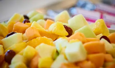 a pile of fruit and vegetables on a plate at Staybridge Suites Niagara-On-The-Lake by IHG in Niagara on the Lake