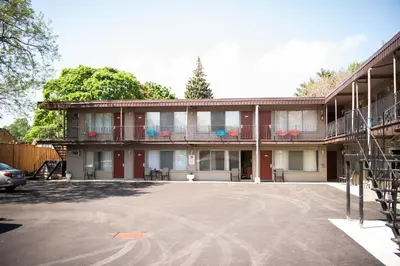 an empty parking lot in front of a building at Advance Inn in Niagara Falls